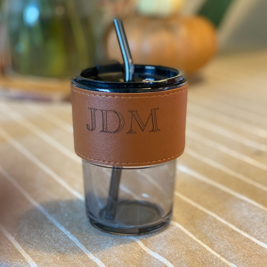 Leatherette engraved glass tumbler.